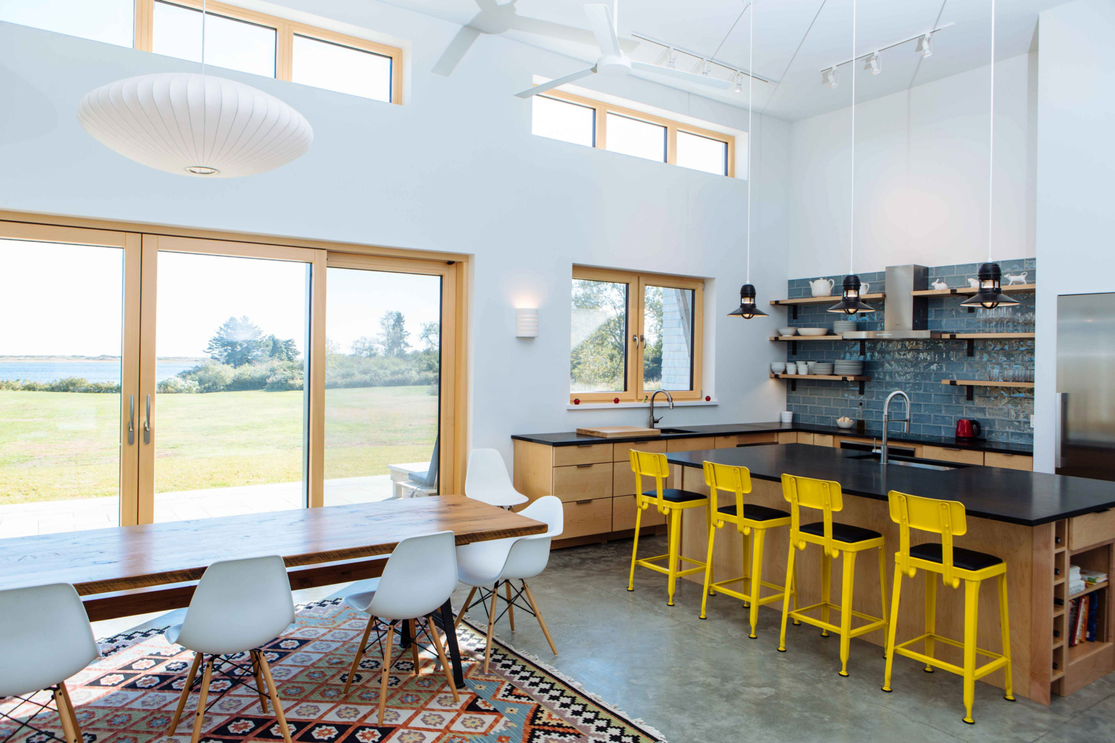 High ceilings with clerestory windows let in abundant light to the open kitchen and living spaces.