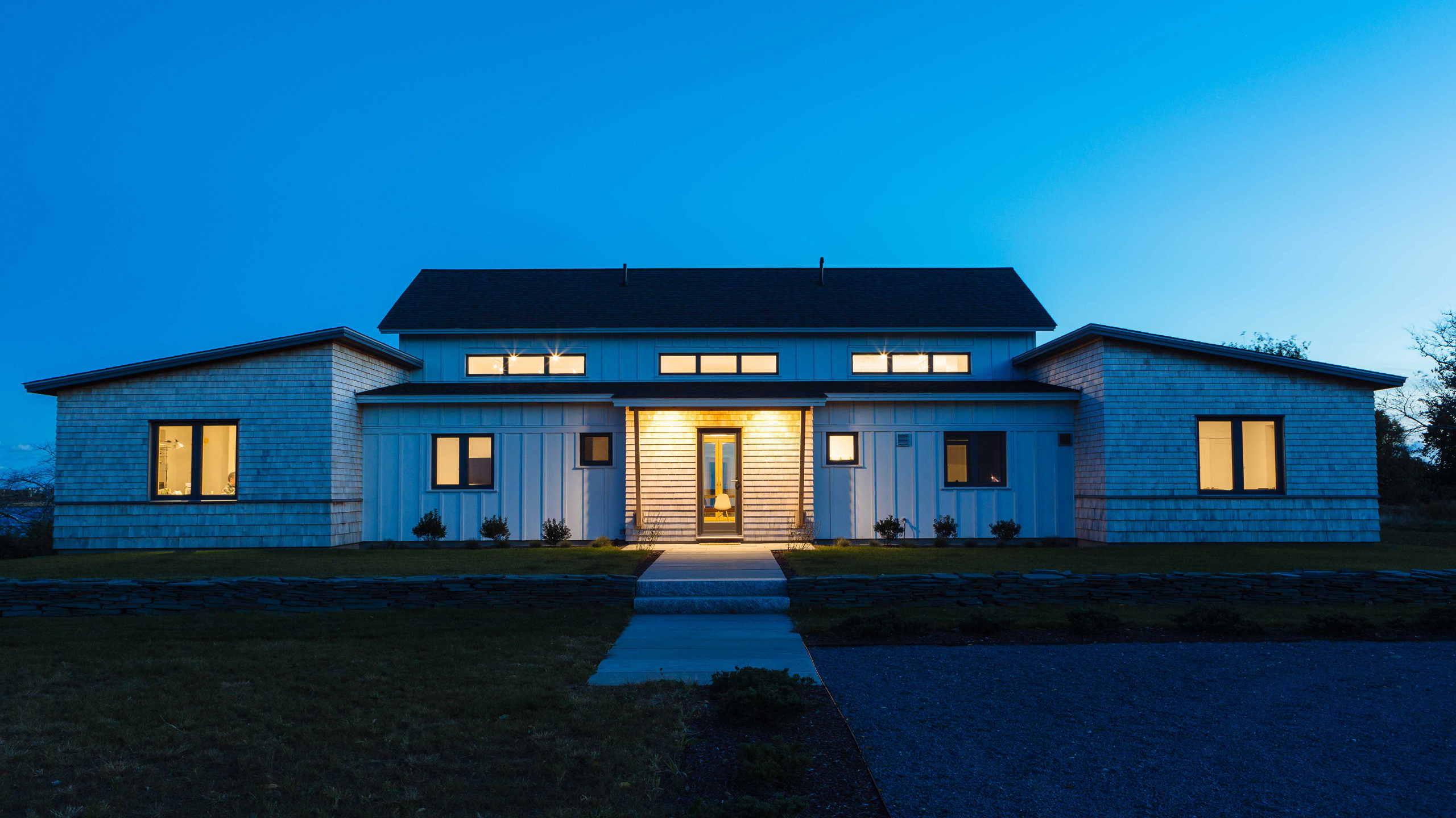 Front of house with entry lights at dusk