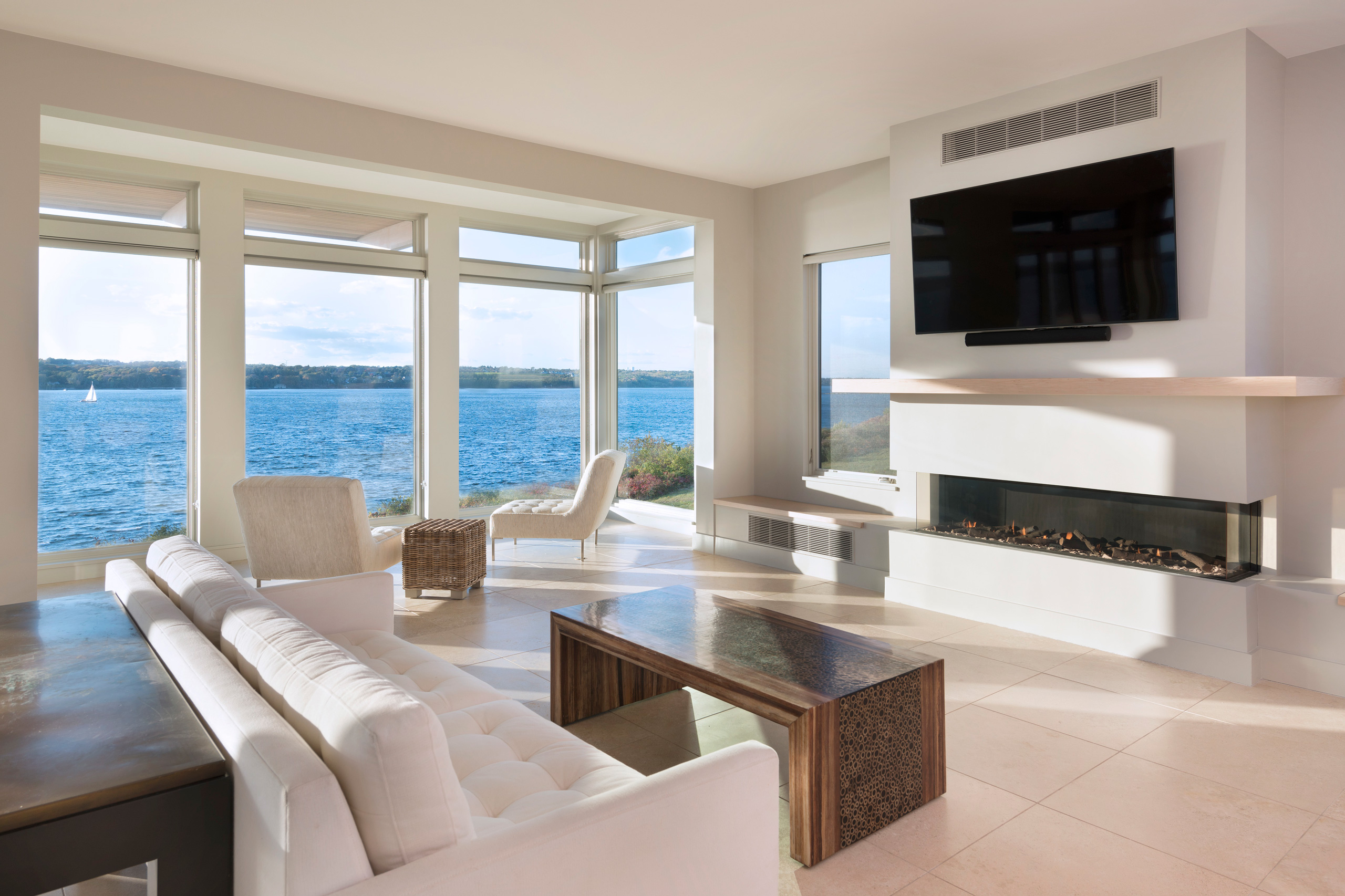 Living and sitting room with expansive view of water
